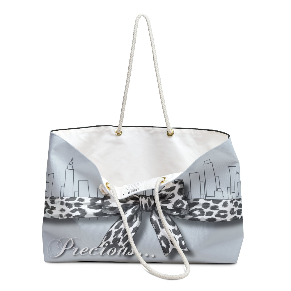 Palm Beach Proper Precious Tote bag with leopard print ribbon and city skyline design on a white background