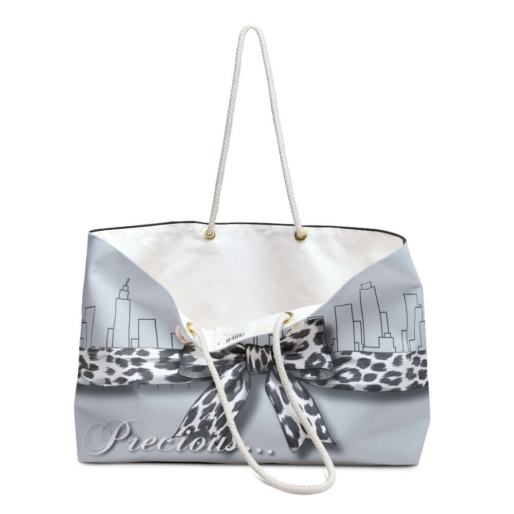 Palm Beach Proper Precious Tote bag with leopard print ribbon and city skyline design on a white background