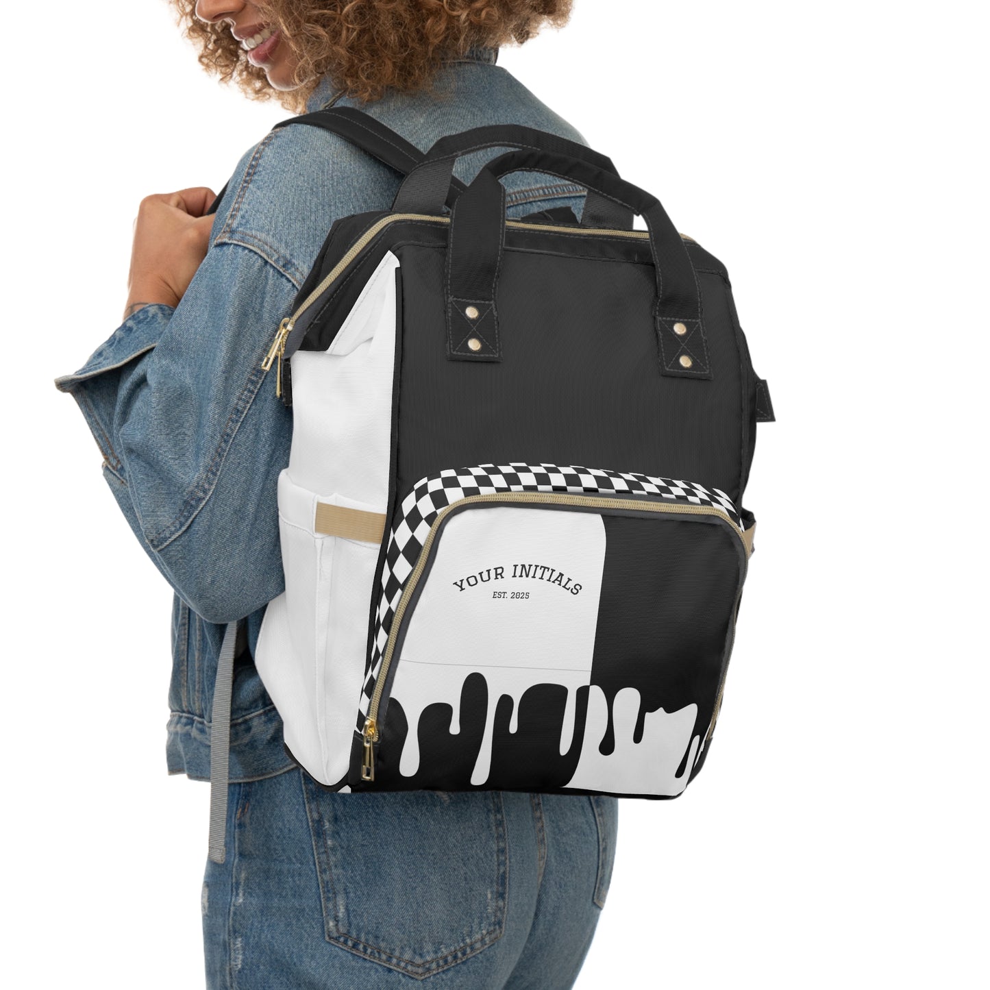 Person wearing a black and white backpack with checkered pattern and text