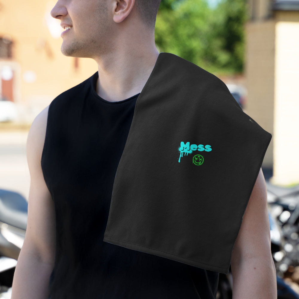 Dad wearing a black sleeveless shirt with the PBP 'Mess' burp cloth from the PBP Graffiti Style Dad's Diaper Backpack outdoors