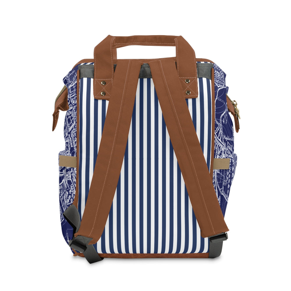 Backpack with blue and white striped pattern and brown straps on a white background