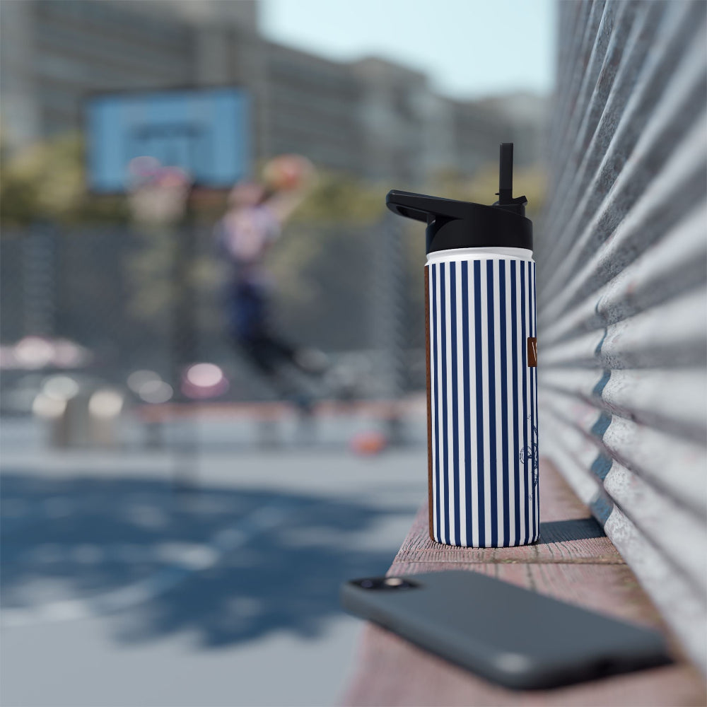 18oz. PBP stainless steel water bottle for dad's nautical style diaper backpack. Professional look, custom engraving.Blue striped and white insulated tumbler with a blurred background of a basketball game.