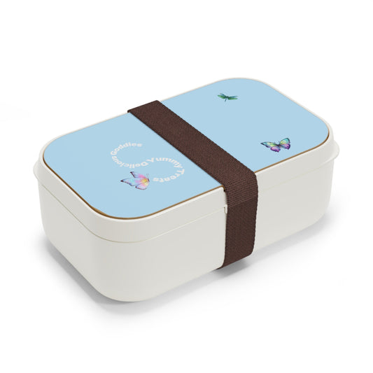 Rectangular bento box with a blue top and white base, featuring butterfly designs and a brown strap. Garden party palm beach proper