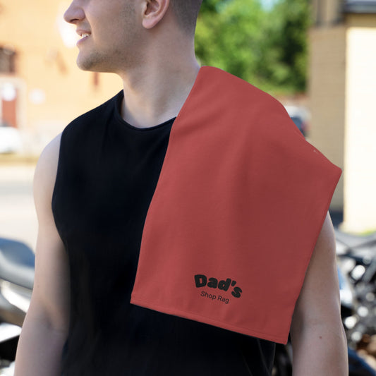 Dad wearing a Shop Rag Burp Cloth with 'Dad's Shop Rag' text draped over his shoulder outdoors.