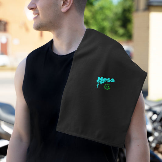 Dad wearing a black sleeveless shirt with the PBP 'Mess' burp cloth from the PBP Graffiti Style Dad's Diaper Backpack outdoors