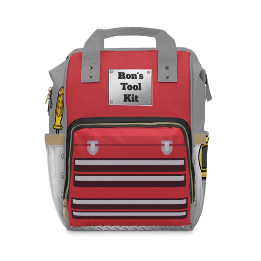 PBP Tool Box Style Red Dad's Diaper Backpack with 'Ron's Tool Kit' label on a white background